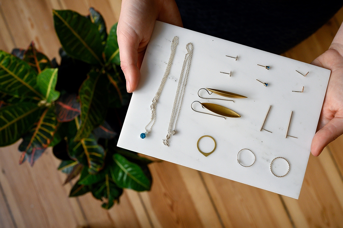 Collection of jewelry on marble tray