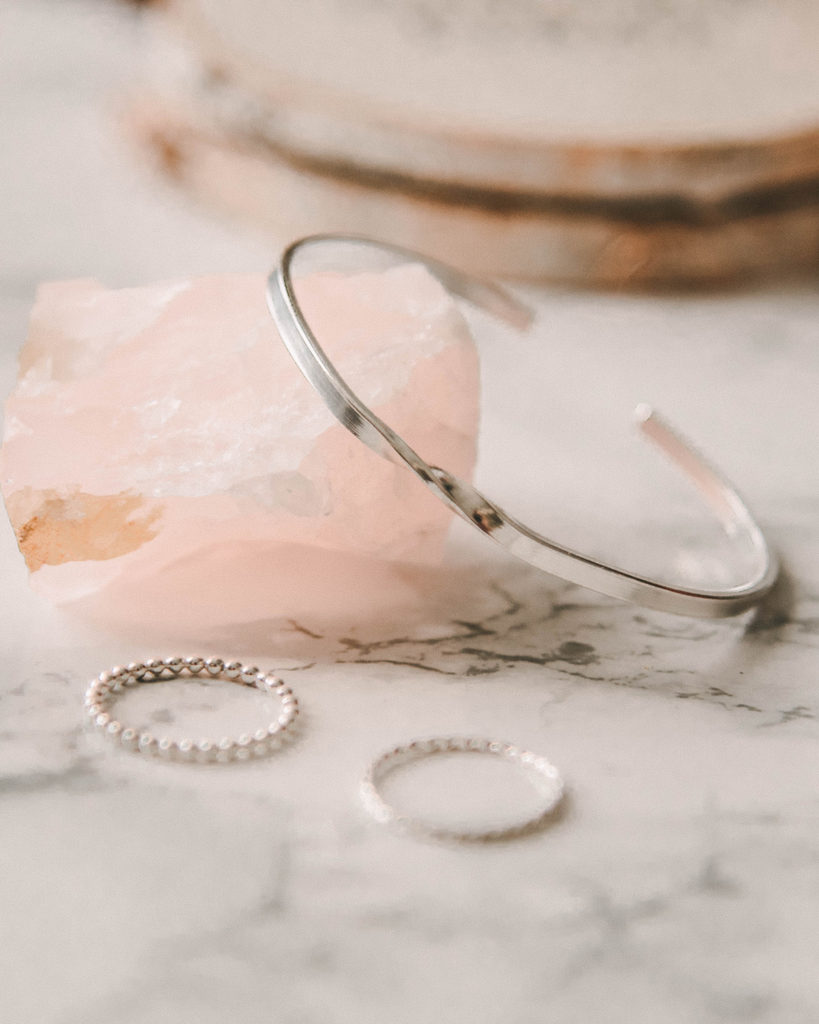 Twist bangle and stacking rings on rose quartz