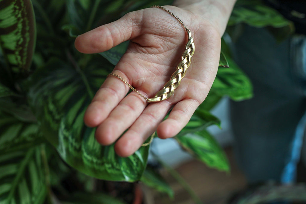 Batur necklace and plant