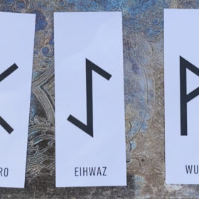 Rune divination reading for October 25th shows three card spread with Perthro, Eihwaz, and Wunjo.