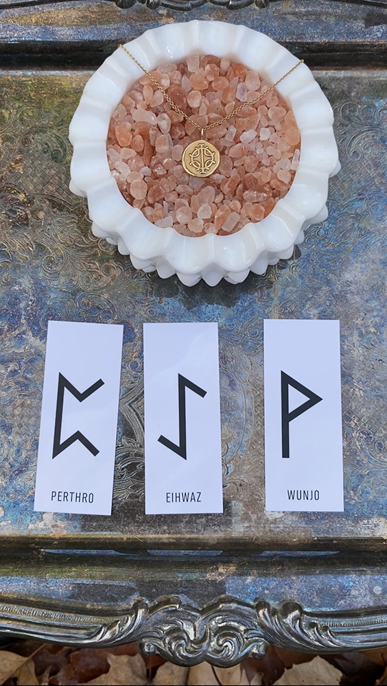 Rune divination reading for October 25th shows three card spread with Perthro, Eihwaz, and Wunjo.