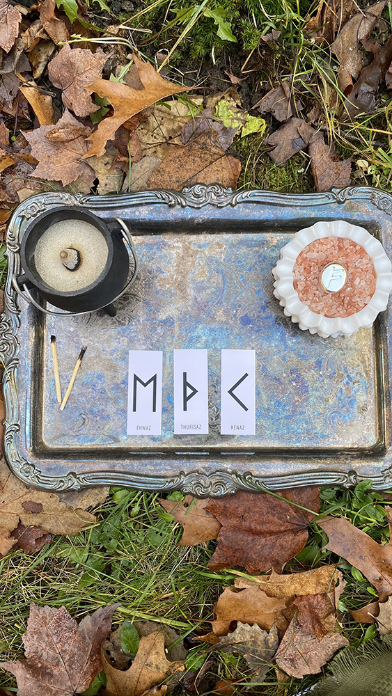 Rune divination reading for November 1 shows three card spread of Ehwaz, Thurisaz and Kenaz