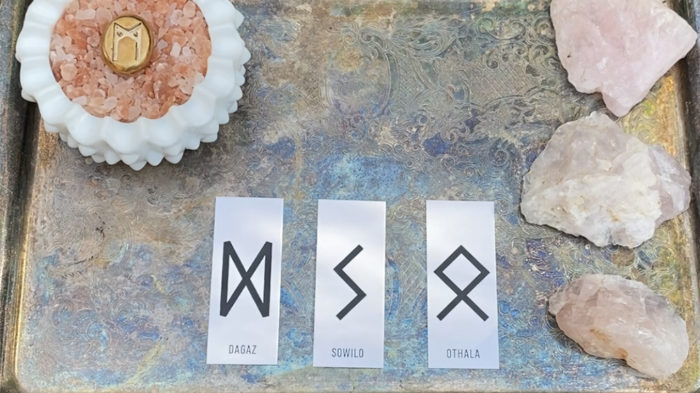 Rune divination reading for November 8th shows three cards Dagaz, Sowilo, Othala.