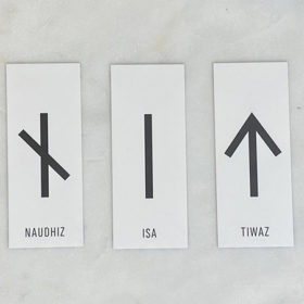 Rune divination reading for November 22 shows three cards: Naudhiz, Isa, Tiwaz