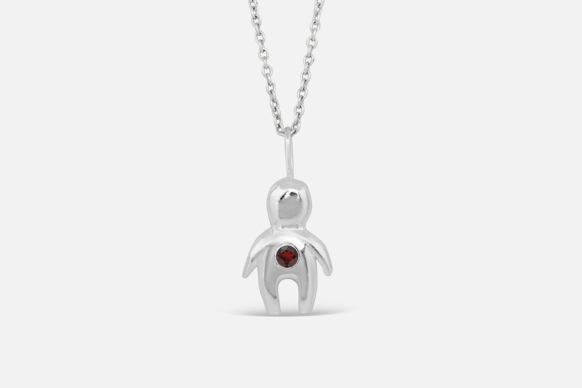 Silver totem necklace with January birthstone garnet.