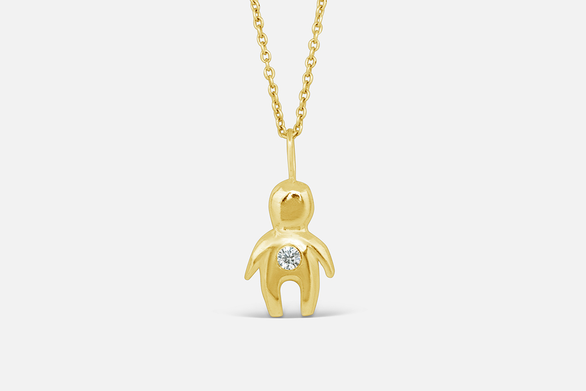 gold totem necklace with april birthstone diamond