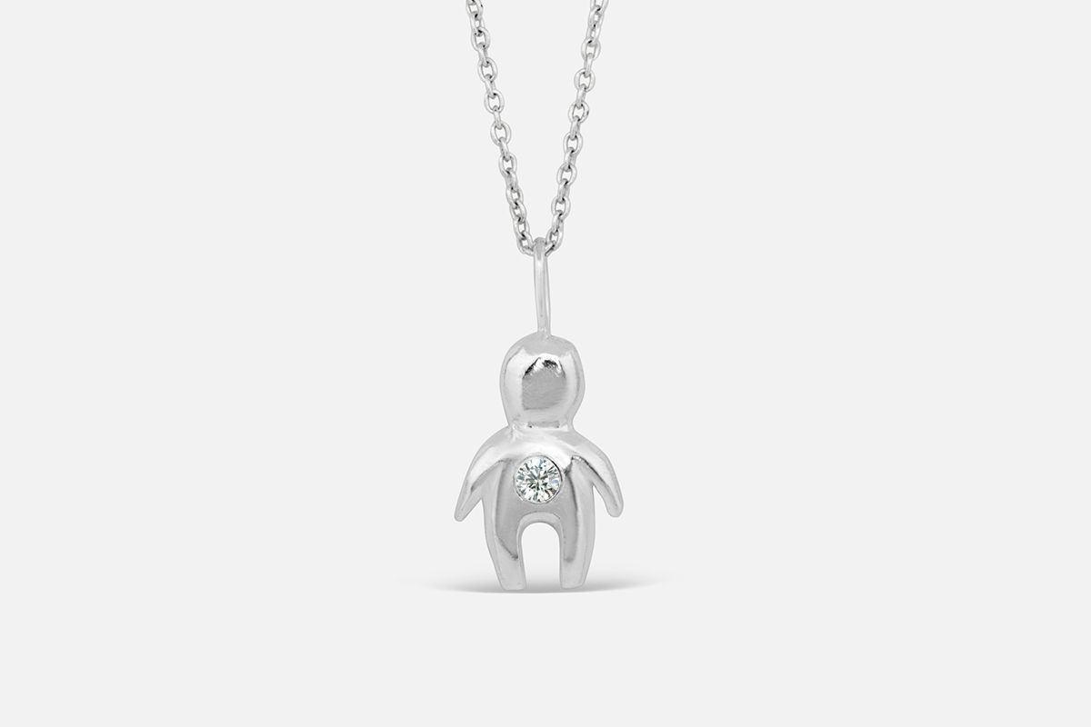 silver totem necklace with april birthstone diamond