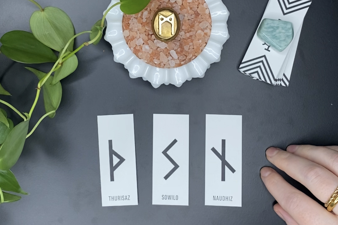 Rune Reading for March 21st shows three cards: Thurisaz, Sowilo, and Naudhiz