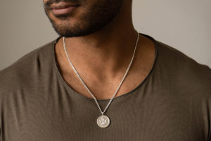 Large Danobus Icelandic Magic Pendant in Sterling Silver shown on model with grey t-shirt.