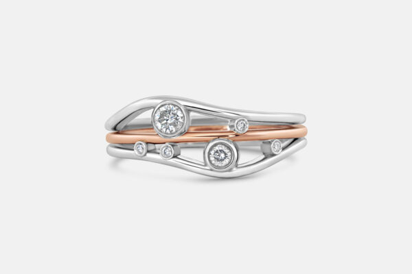 Custom white and rose gold family ring with diamonds