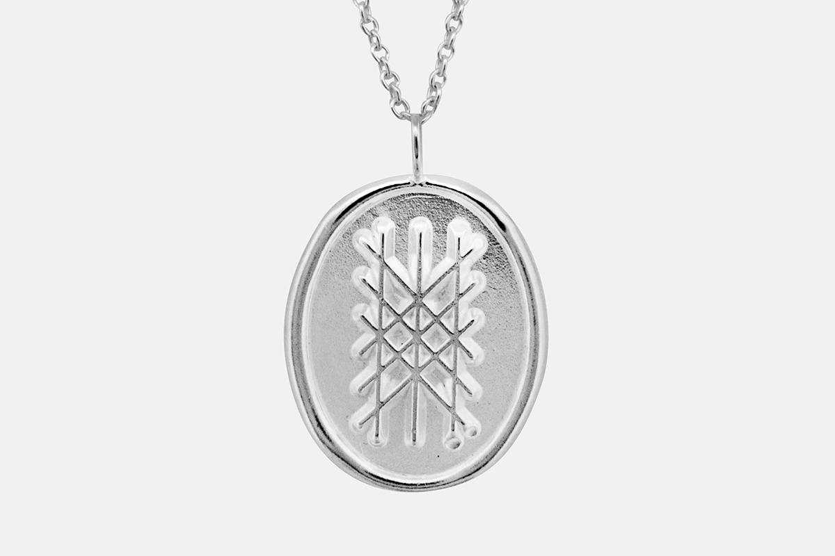 Sterling silver web of wyrd pendant.