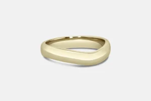 Contoured wedding band in yellow gold.