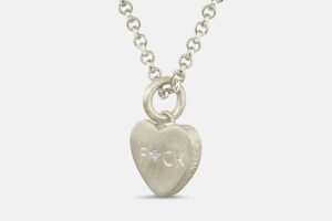 White gold conversation heart pendant with hand engraved FUCK and diamonds.