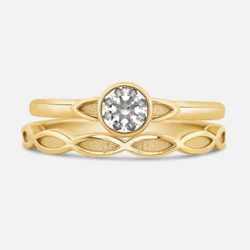 Vintage inspired diamond engagement ring with matching wedding band.